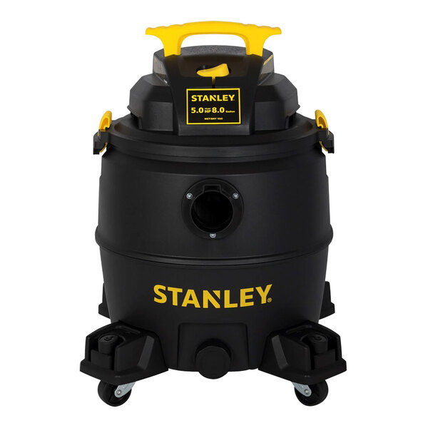 A black and yellow Stanley wet/dry vacuum container with wheels and a yellow handle.