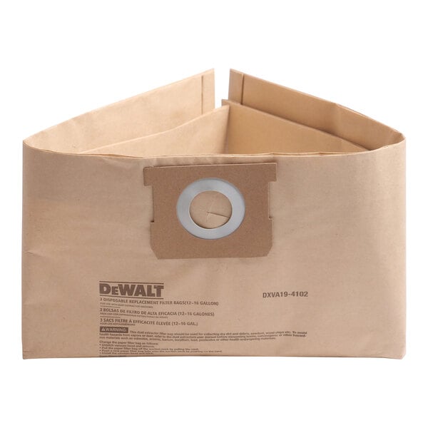A brown circular paper filter bag with a hole in it.