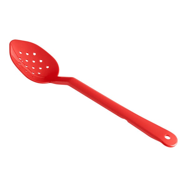A red polycarbonate spoon with holes.