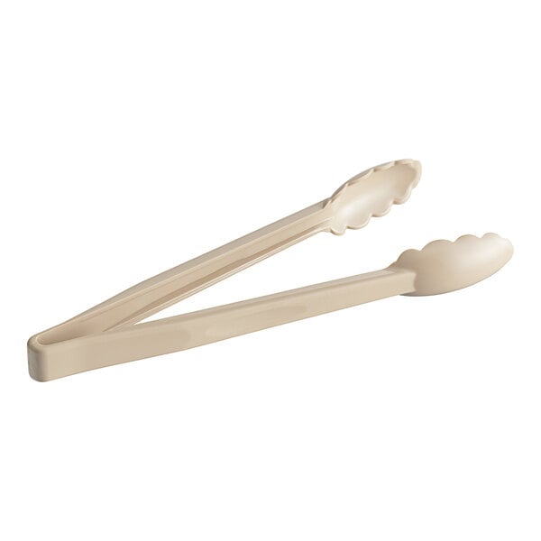 A pair of Choice beige polycarbonate tongs with scalloped grips.