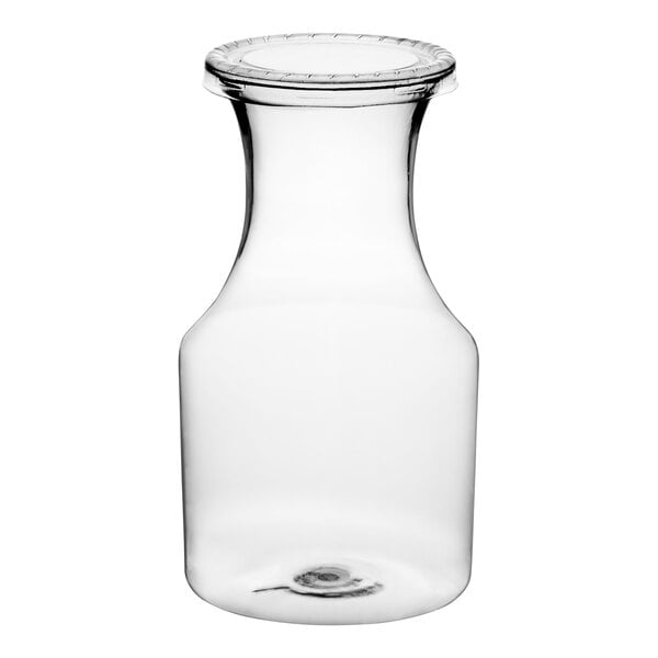 A clear plastic carafe with a white lid.