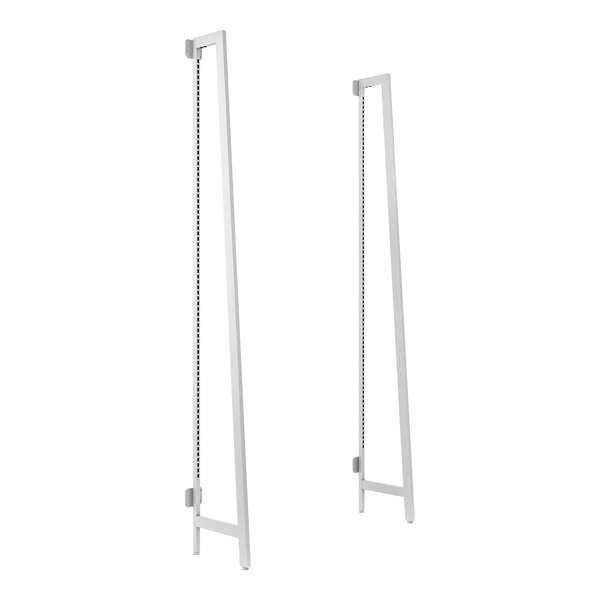 A pair of white metal poles with black holes.