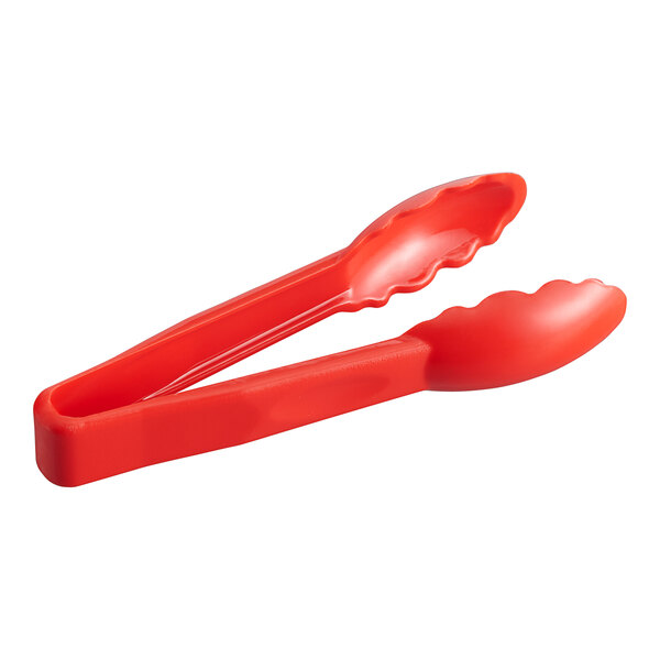 Red polycarbonate tongs with scalloped edges and long handles.