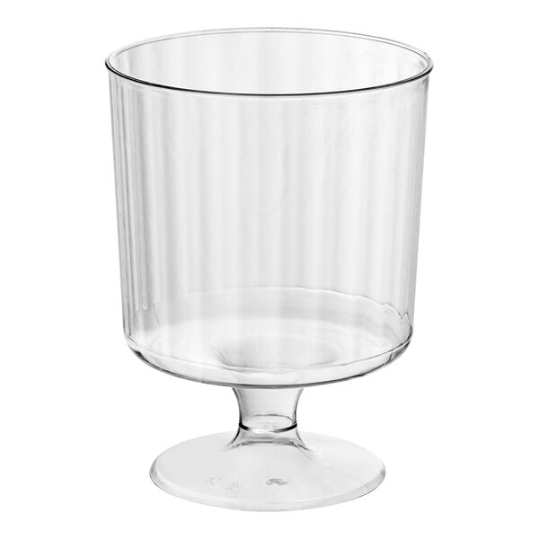 A clear plastic wine cup with a base.