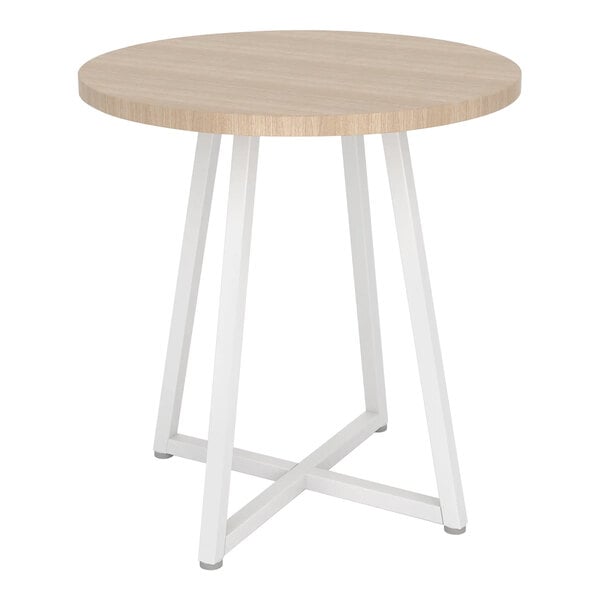 A round white retail display table with a woodgrain top.