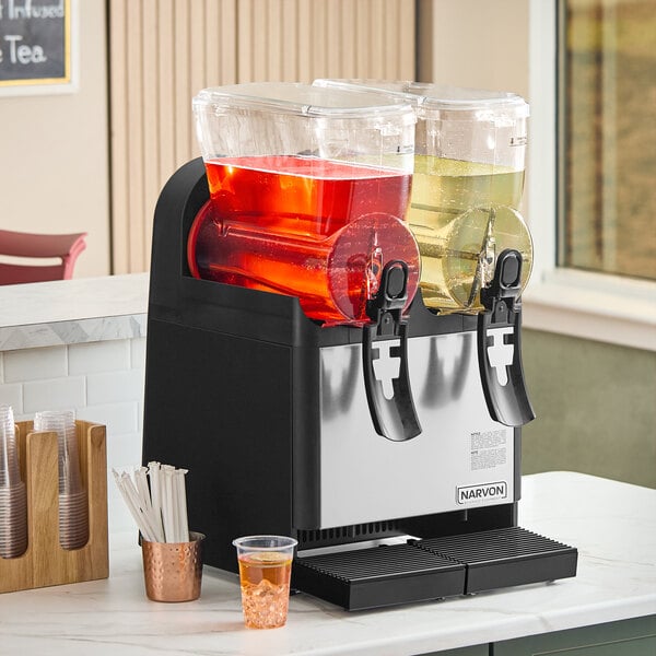 A double-bowl refrigerated beverage dispenser with clear containers holding red and yellow drinks, designed for serving cold beverages.