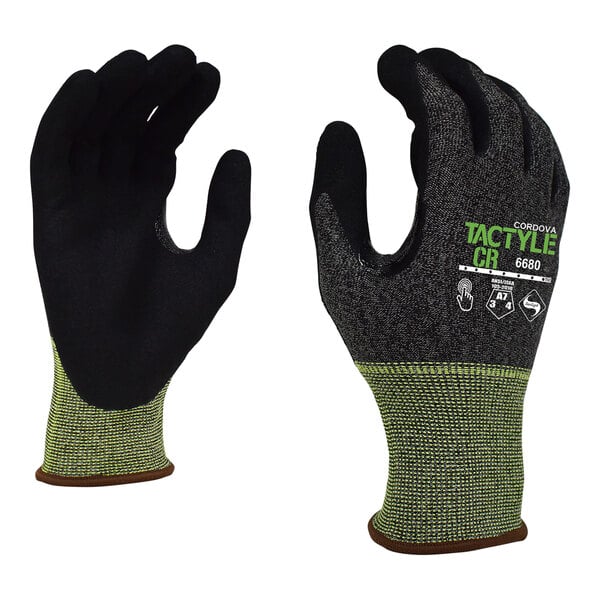 A pair of small black and green Cordova Tactyle gloves with Tuf-Cor sandy nitrile palm coating.