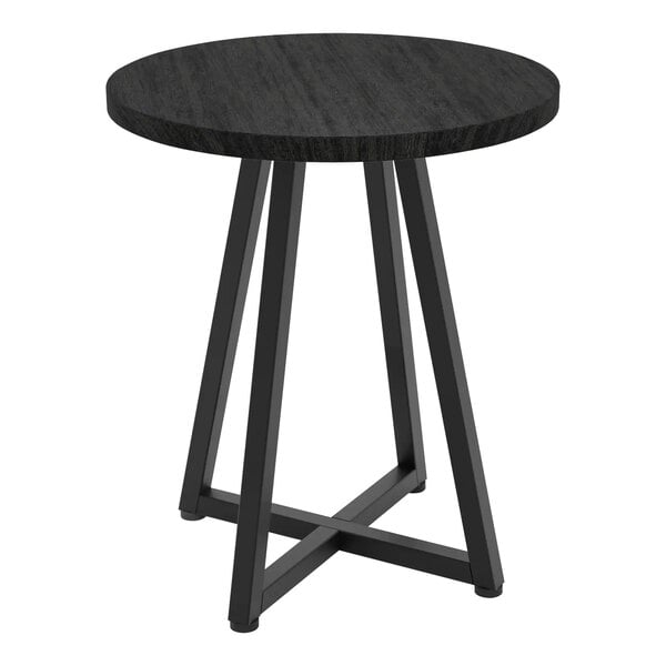 A round matte black metal nesting display table with black woodgrain top.