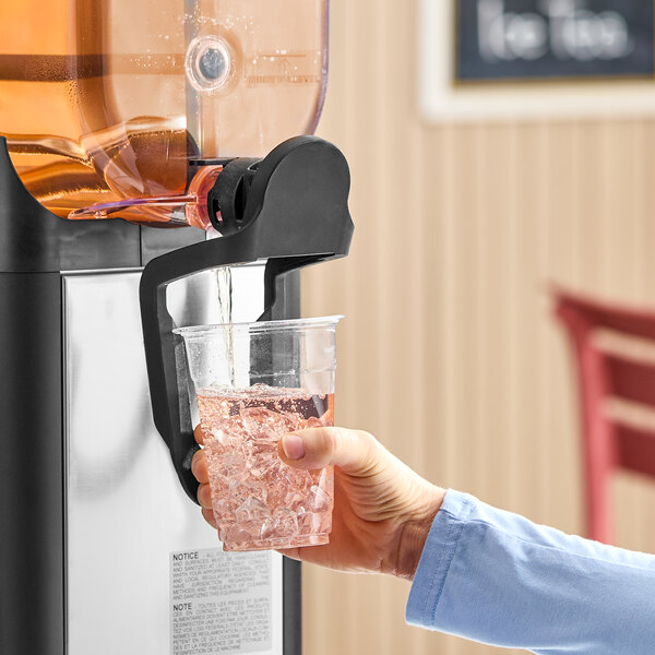 A single 5-gallon bowl refrigerated beverage dispenser with a spout pouring a drink into a plastic cup filled with ice.