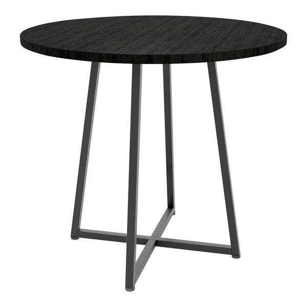 A round black metal display table with a black woodgrain top.