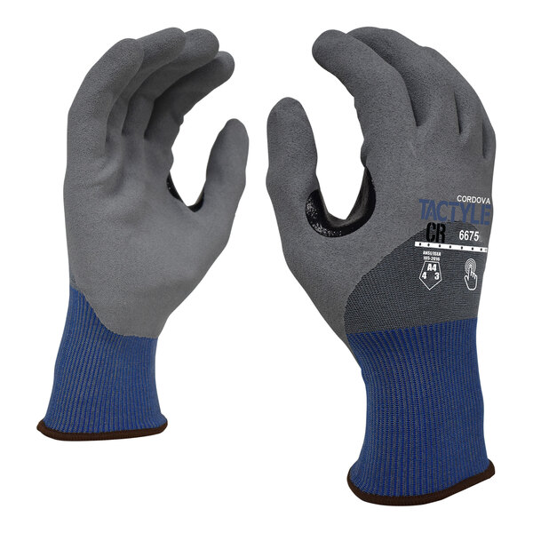 A close-up of a pair of Cordova Tactyle cut-resistant gloves with a blue and grey design.
