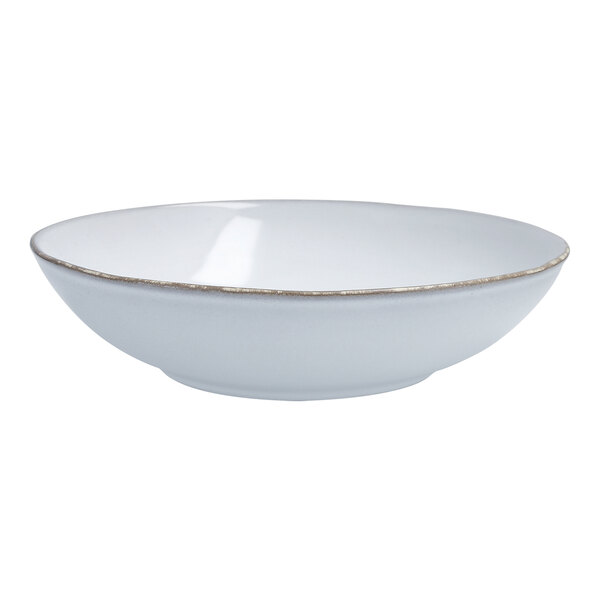 A white Nosse stoneware bowl with a gold rim.