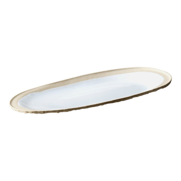 A white oval platter with a gold rim.