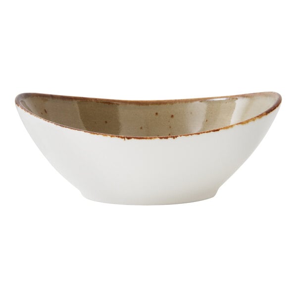 An Erthe by Fortessa Basics oval bowl with a brown speckled rim.