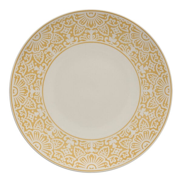 A white and yellow Havana by Fortessa coupe plate with a pattern and gold border.