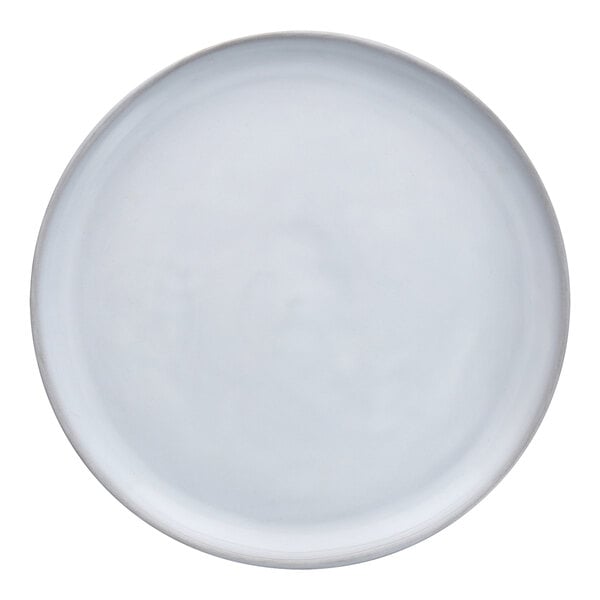 A close-up of a white Nosse by Fortessa stoneware plate with a grey rim.