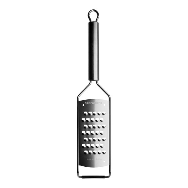 A Microplane stainless steel grater with a handle.