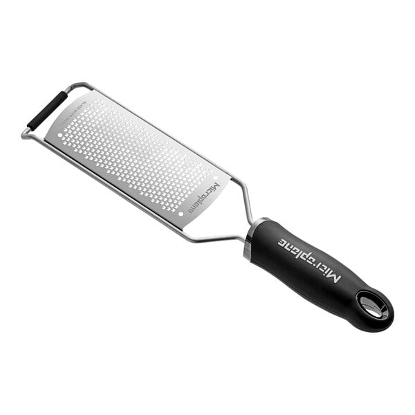 A Microplane Gourmet black and silver fine grater.