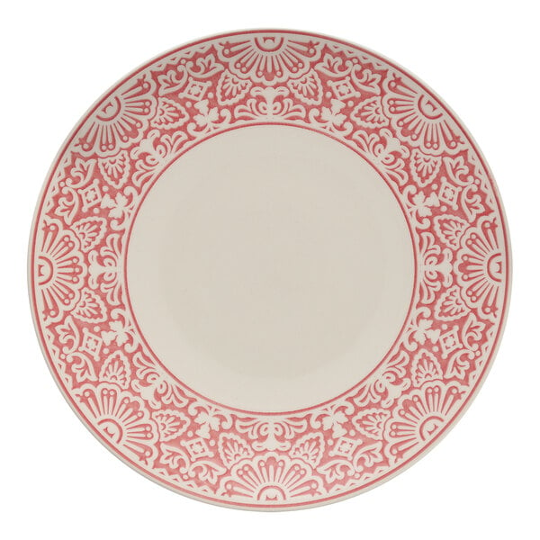 A white Havana by Fortessa coupe plate with a red design on the border.