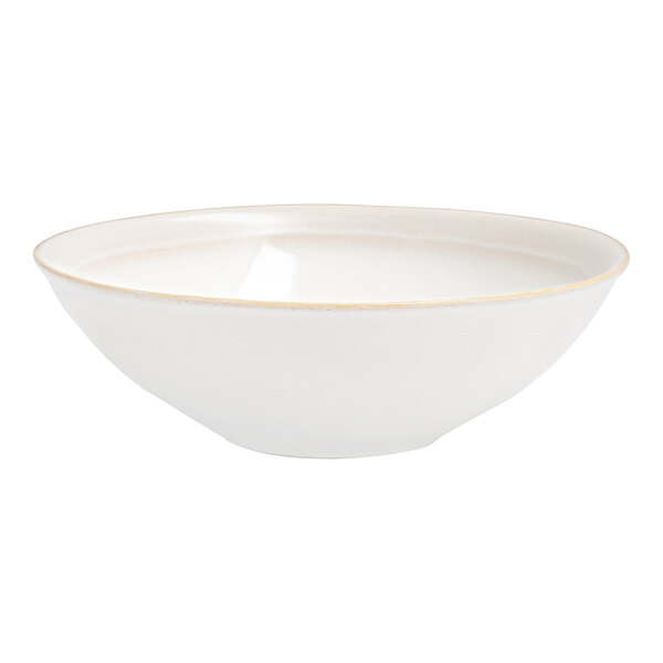 A white Nosse stoneware bowl with a gold rim.