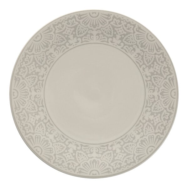 A close up of a white Havana by Fortessa coupe plate with a grey pattern.