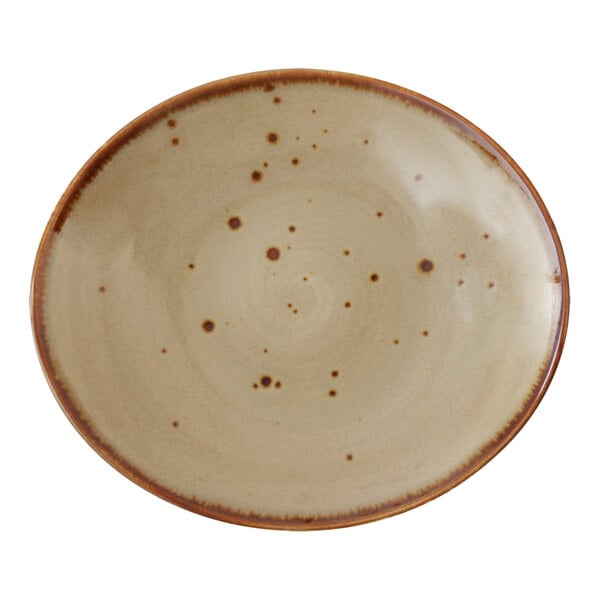 A close-up of a brown Erthe by Fortessa TechnoCeram oval platter with dots on it.