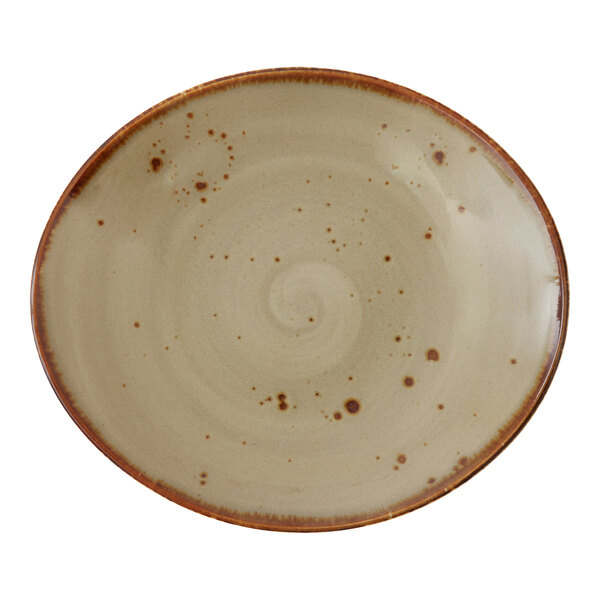 A close-up of a white Erthe by Fortessa Shiitake TechnoCeram oval platter with a speckled design.