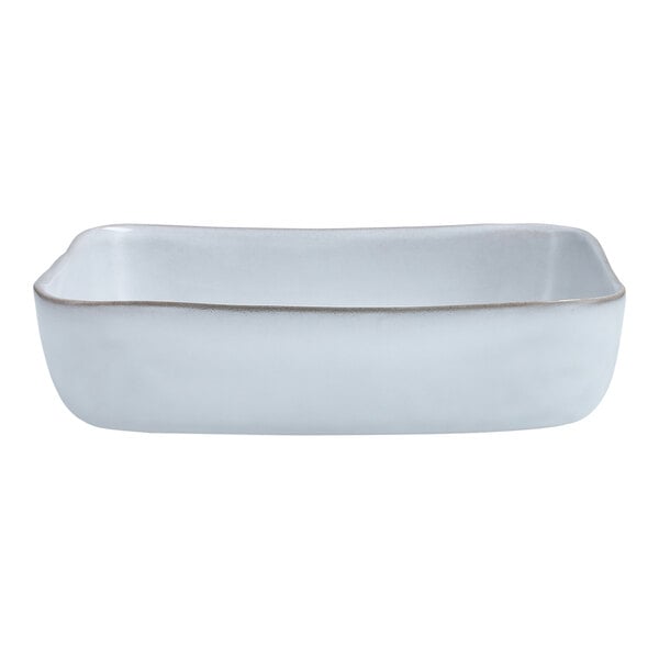 A white rectangular stoneware baker with a gray rim.