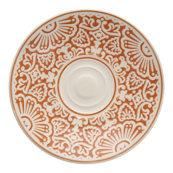 A white Havana by Fortessa saucer with an orange design on it.