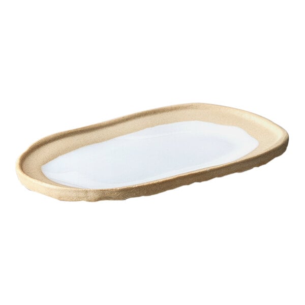 A Nosse by Fortessa white stoneware oval platter with a white rim.