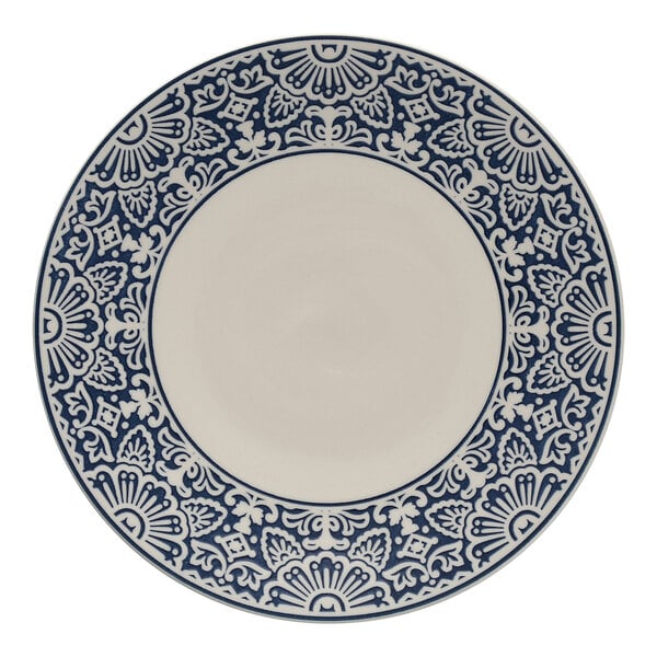 A white and blue Havana by Fortessa coupe plate with a design on the border.