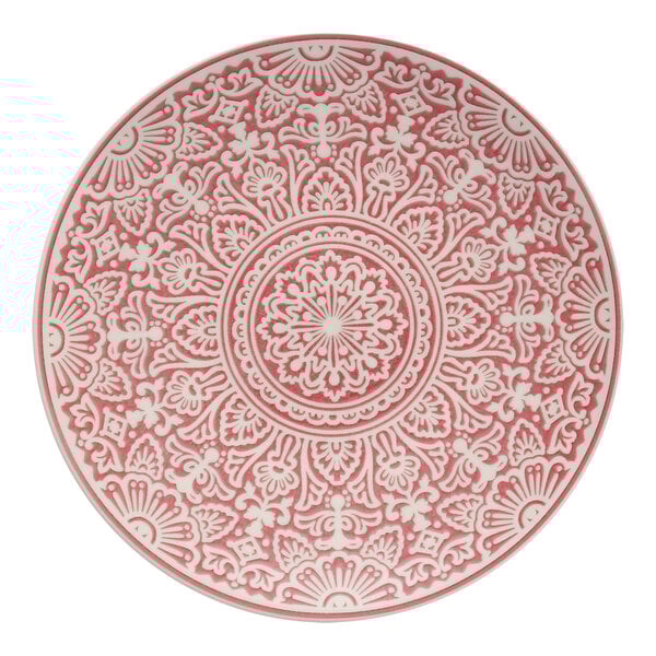 A Havana by Fortessa rose coupe plate with a red and white circular design.