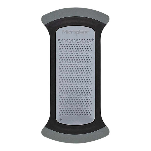 A white rectangular Microplane grater with a grey and black mesh.