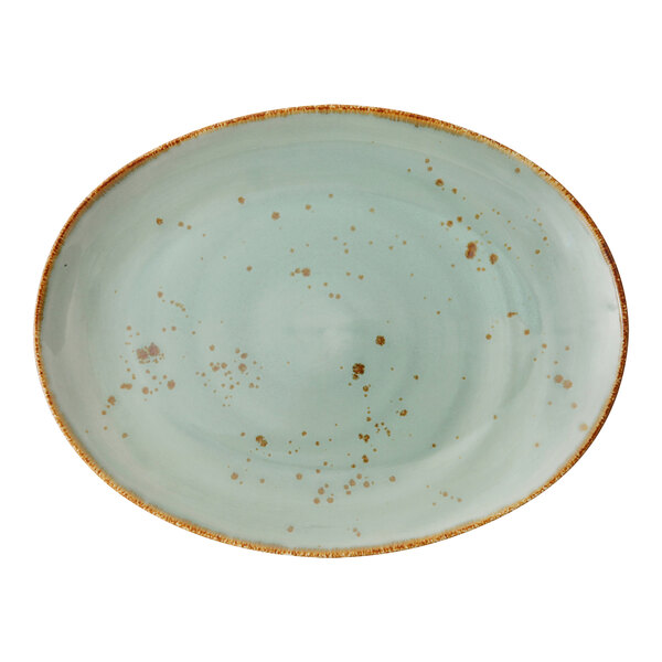 An oval white Erthe TechnoCeram platter with brown specks.