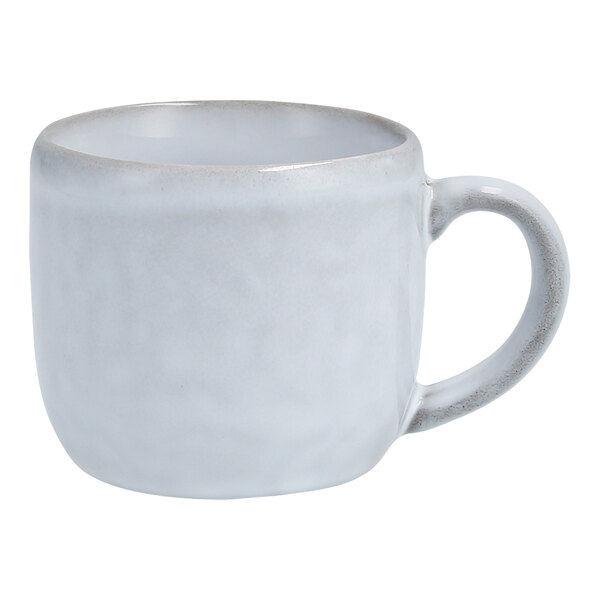 A white Nosse by Fortessa Stoneware espresso cup with a handle.