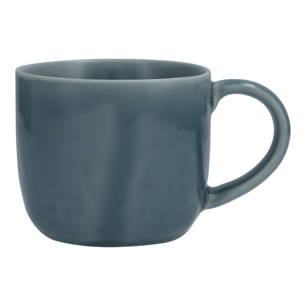 A close-up of the handle of a deep blue Nosse by Fortessa Svelte stoneware mug.