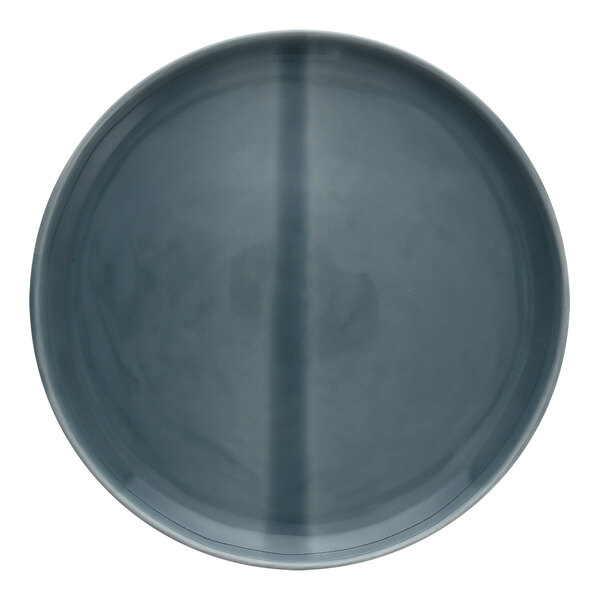 A deep blue stoneware plate with a grey cross.