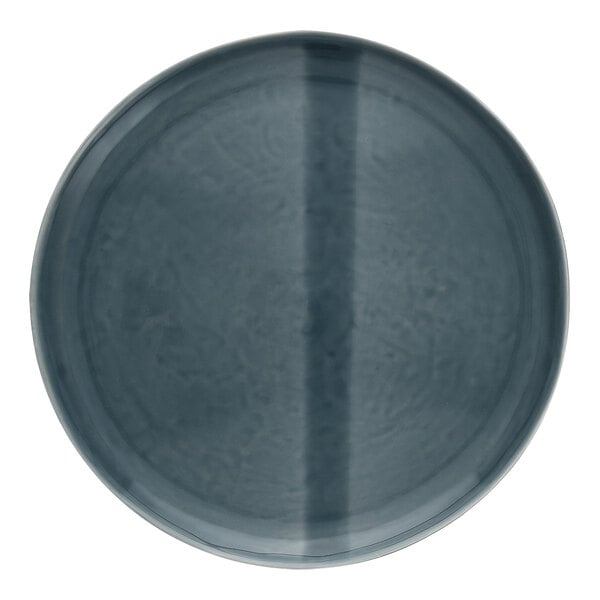 A close-up of a deep blue Nosse by Fortessa Svelte stoneware plate.