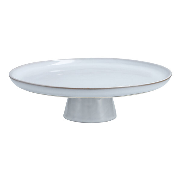 A white stone cake stand with a metal base.