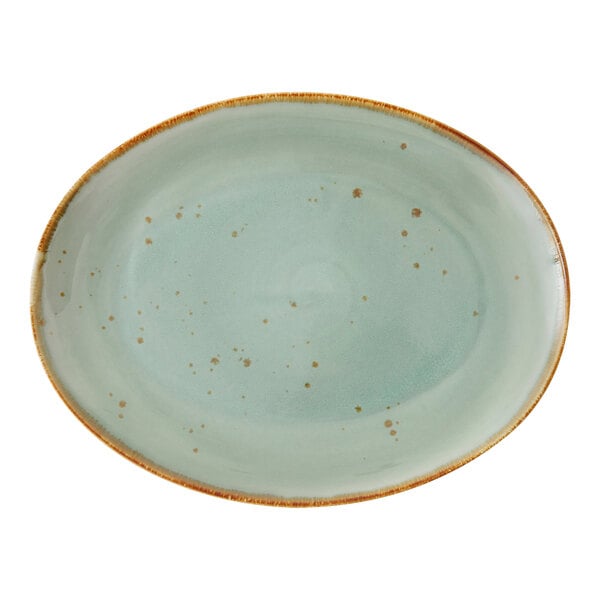 A white oval platter with brown specks around the rim.