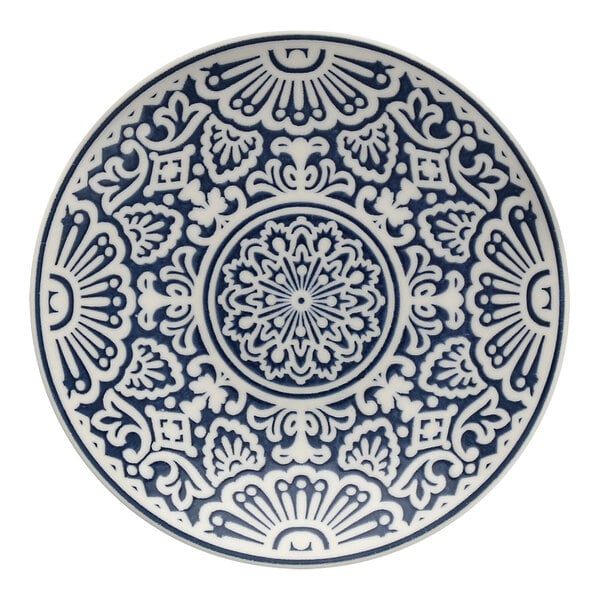 A Havana by Fortessa blue and white coupe plate with an intricate design.