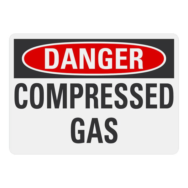 A white rectangular safety label with black and red text that reads "Danger / Compressed Gas" with a black border.