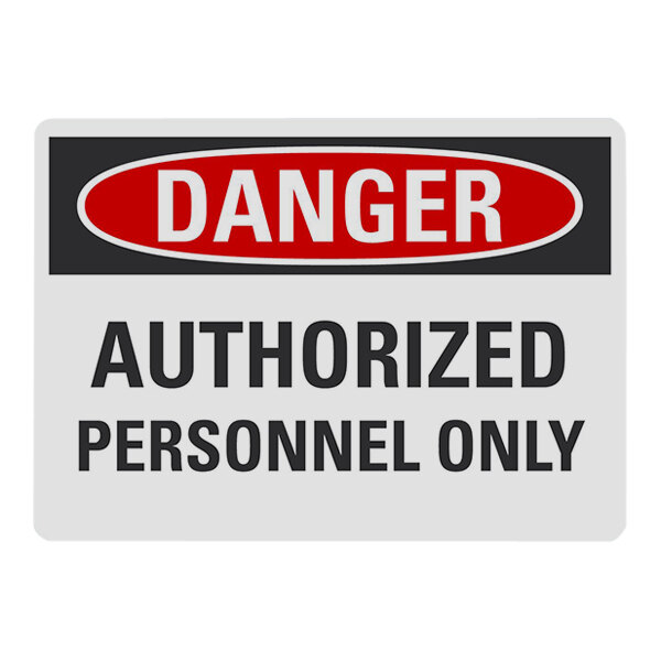 A white sign with a red and black text border that says "Danger / Authorized Personnel Only" in red and black text.