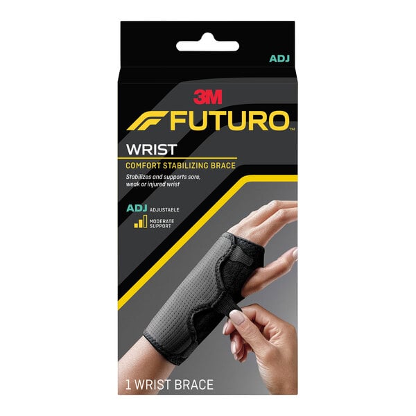 A hand wearing a black 3M Futuro wrist brace.