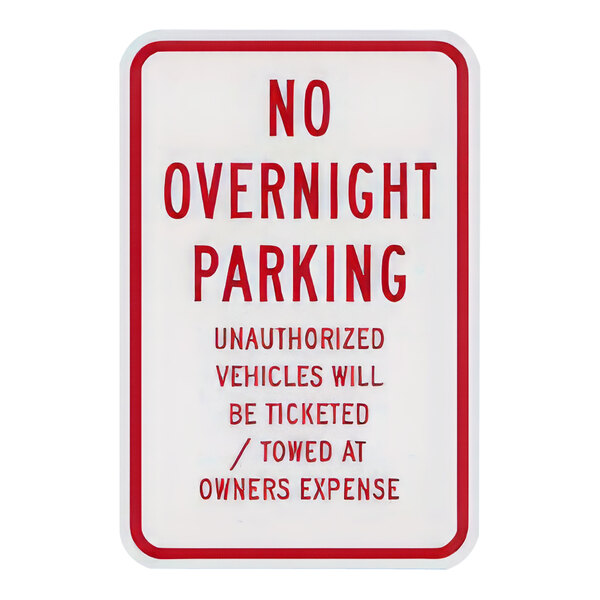 A close up of a white and red Lavex parking lot sign with red text reading "No Overnight Parking / Unauthorized Vehicles Will Be Ticketed / Towed At Owner's Expense" on a white background.