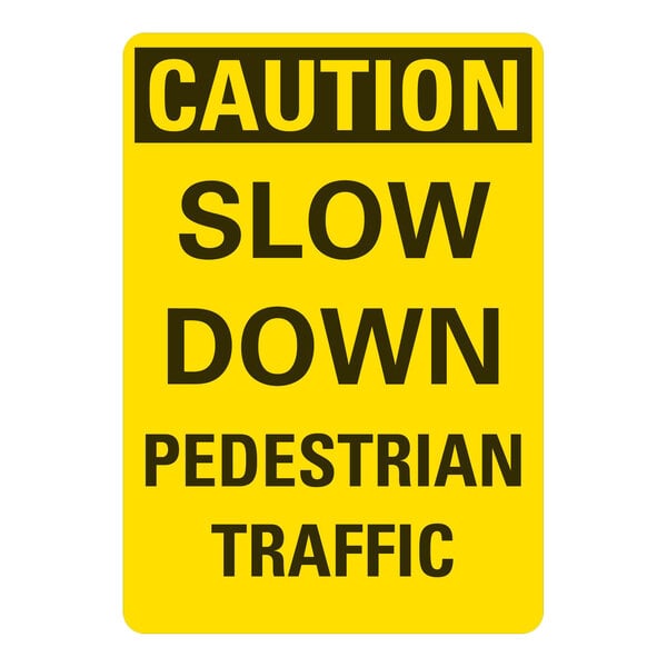 A white and yellow aluminum sign that says "Caution Slow Down Pedestrian Traffic"