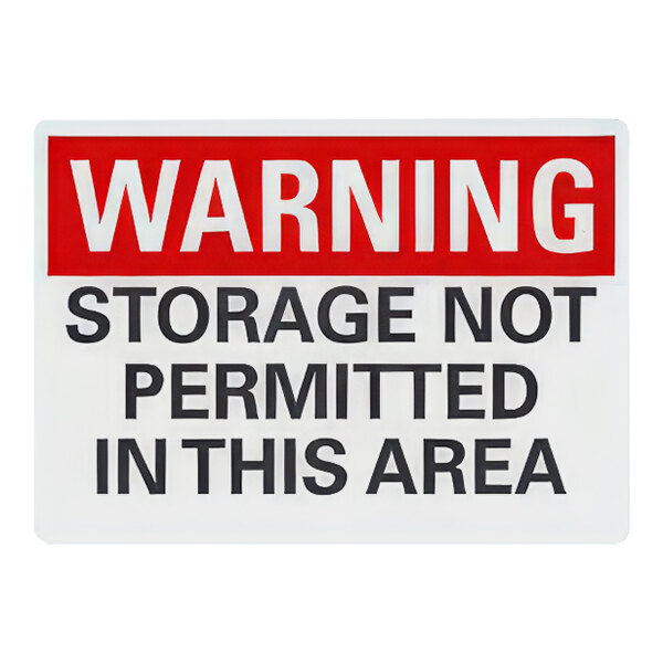 A white plastic sign with red letters reading "Warning / Storage Not Permitted In This Area"