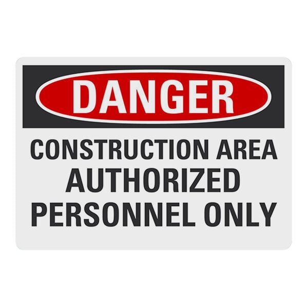 A red and white aluminum sign that says "Danger Construction Area Authorized Personnel Only" in black text.