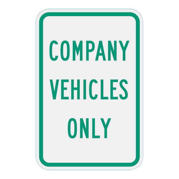 A close up of a white and green "Company Vehicles Only" sign with green text.