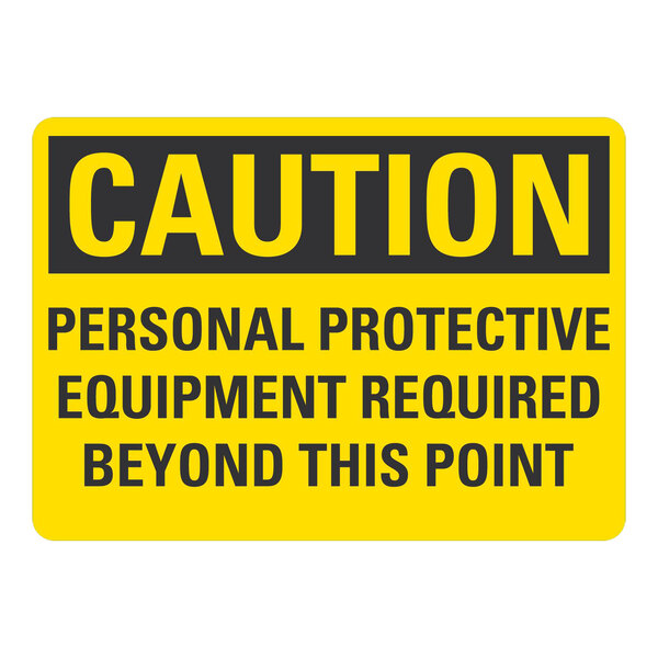 A yellow and black plastic safety sign that says "Caution / Personal Protective Equipment Required Beyond This Point"